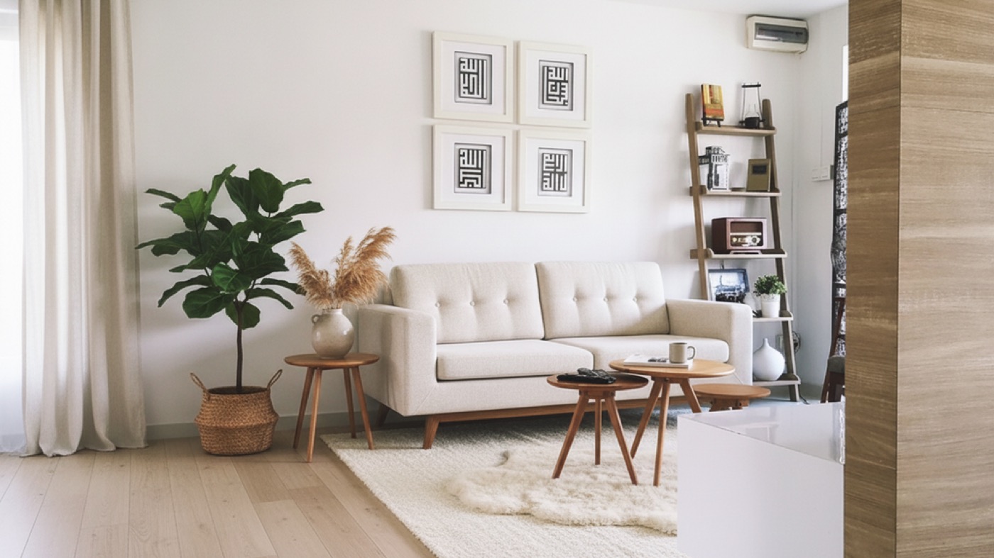 The same room redesigned in a warm Scandinavian style with a boucle sofa and oak floor