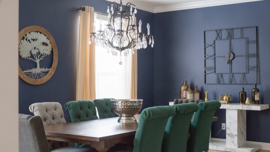 The same dining room redesigned into a luxury dining room with emerald velvet, dark walnut and antique brass